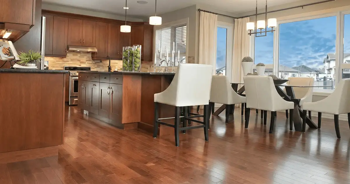 A modern kitchen with professionally installed wood flooring in Grand Rapids, MI