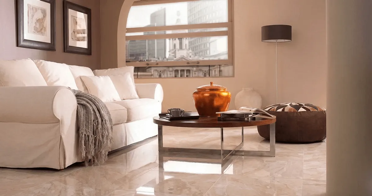 Modern living room with professionally installed marble flooring, a beige sofa, coffee table in Grand Rapids, MI