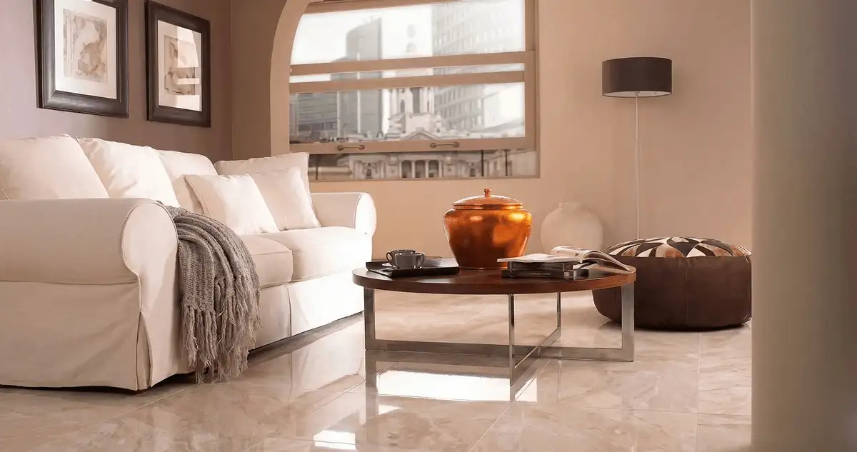 Modern living room with professionally installed marble flooring, a beige sofa, coffee table in Grand Rapids, MI