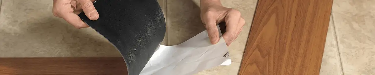 A professional installing vinyl flooring in Grand Rapids, MI